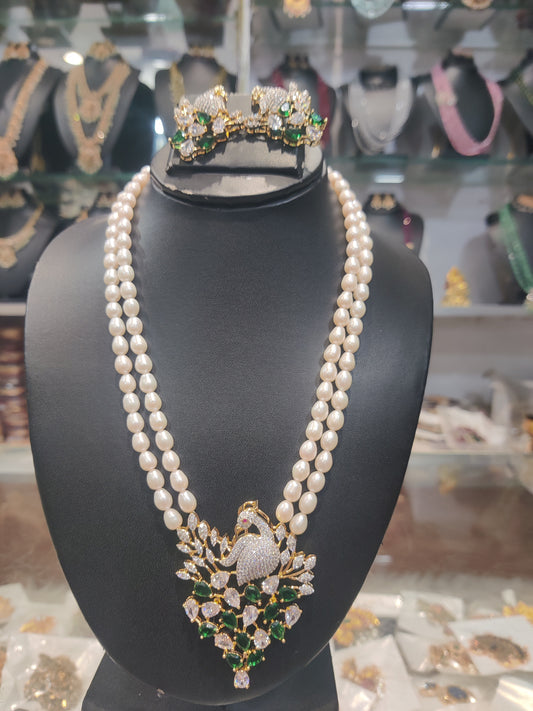 Pearls set two lines pearls with "ovel shape"cz locket set peacock design