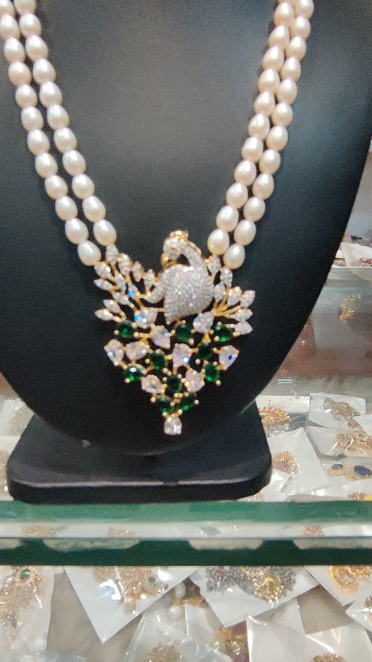 Pearls set two lines pearls with "ovel shape"cz locket set peacock design